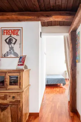 a room with white walls and a wooden ceiling at A Secret Corner in Rome