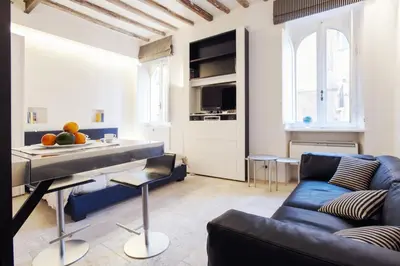 a living room with a couch and a table at Oro in Rome