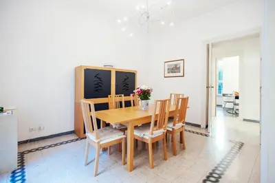 a dining room with a wooden table and chairs at Palestrina in Rome