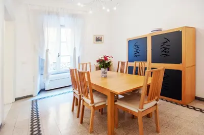 a dining room with a wooden table and chairs at Palestrina in Rome