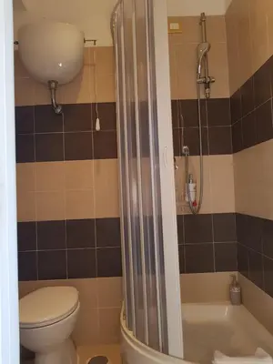 a bathroom with a toilet and a shower at Morgagni House in Rome