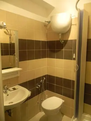 a bathroom with a toilet and a sink at Morgagni House in Rome