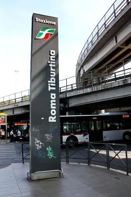a sign in a parking lot with a bus at La Quiete in Rome
