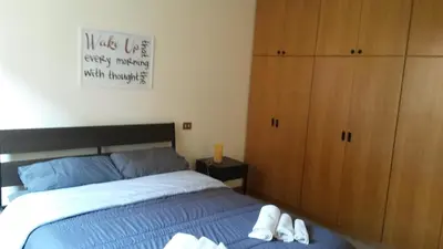 a bedroom with a bed and a wooden cabinet at FamilyBed Roma Monteverde-Vaticano in Rome