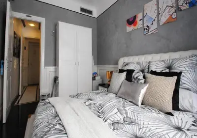 a bedroom with a large bed in a room at Royal Suite Trinità Dei Monti in Rome