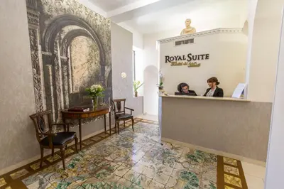 two women standing at the counter of a salon at Royal Suite Trinità Dei Monti in Rome