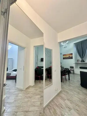 a living room with a view of a dining room at Appartamento Il Tempio Della Capitale in Rome