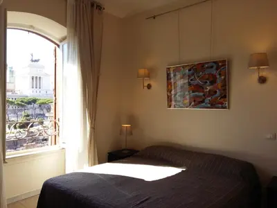 a bedroom with a bed and a window at Residenza Maritti ContemporarySuite - Guesthouse in Rome