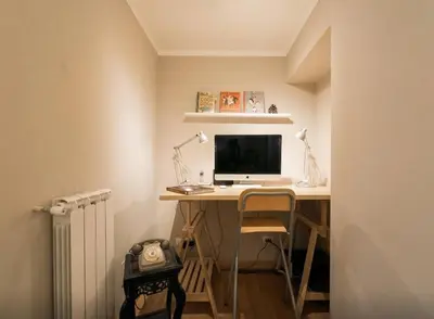 a computer sitting on a desk in a room at Casa Oliva in Rome
