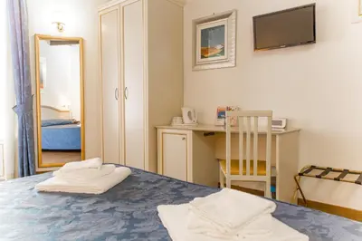 a room with a table with two towels on it at Best Suites Pantheon in Rome