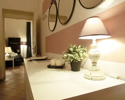 a white lamp sitting on a table in a living room at Magenta Collection Del Grande in Rome