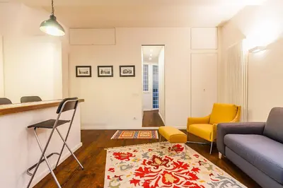 a living room with a couch and a table at Wake At Rome in Rome