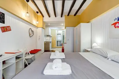 a bedroom with a large bed with towels on it at Trastevere Suite Just Renewed in Rome