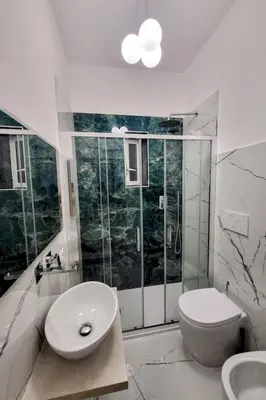 a bathroom with a sink and a toilet and a shower at Apartment 'Rhome Sweet Rhome by Interhome in Rome