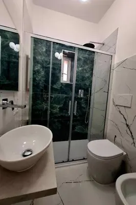 a bathroom with a sink and a toilet and a shower at Apartment 'Rhome Sweet Rhome by Interhome in Rome