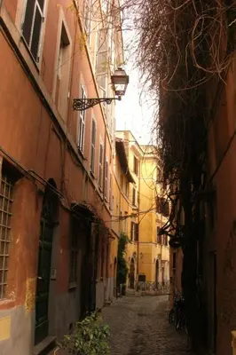 an empty alley way with buildings and a street at Apartment in Trastevere im Herzen von Rom by Interhome in Rome