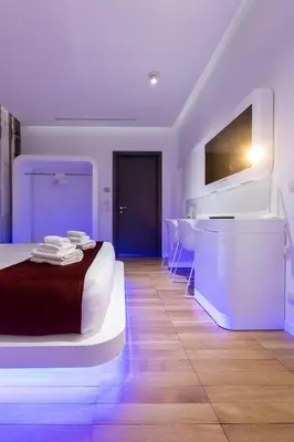 a bedroom with a bed and a bathroom with a tub at Trevi Elite Rome in Rome