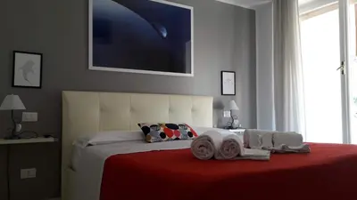 a bedroom with a large bed with towels on it at Domus Raffaello in Rome