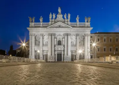 a large white building at night with lights at Ai 7 Scalini in Rome