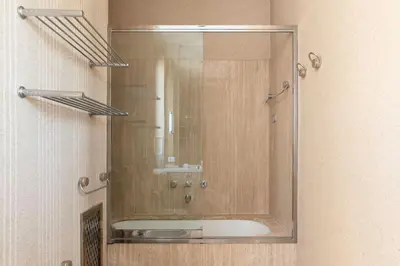 a mirror in a bathroom with a sink at Delizioso loft con terrazzo panoramico a Flaminio in Rome