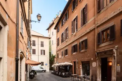 an alley with buildings and a car parked on a street at Loft a due passi dal Pantheon in Rome