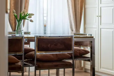 a dining room with a glass table and chairs at Apartment Termini in Rome