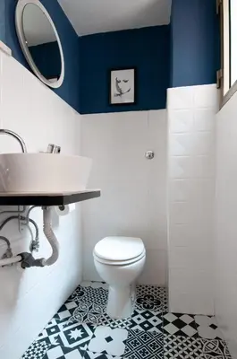 a bathroom with a white toilet and a sink at Apartment Termini in Rome