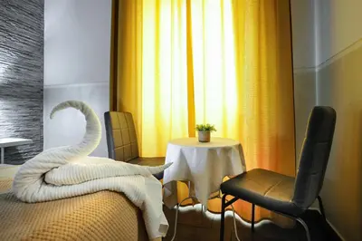 a hotel room with a swan sculpture on the bed at Domus Castroni Pompeo Magno in Rome