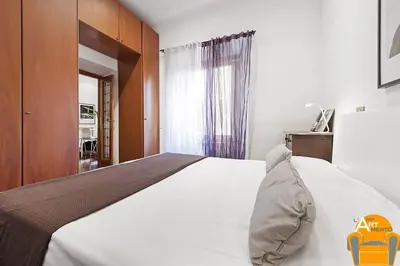 a bedroom with a white bed and a window at 4BNB - Vatican Doors Flat in Rome