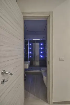 a bathroom with a tub and a toilet and a sink at Vatican Tourist Inn in Rome