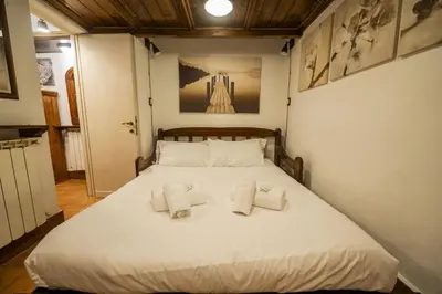 a kitchen with a stove top oven in a room at Romantic Piazza Navona Hideaway in Rome