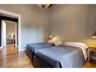 two twin beds in a room with at Apartment Via Giulia in Rome