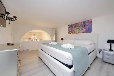 a bedroom with a large bed with towels on it at 4BNB - Domus Colosseo in Rome