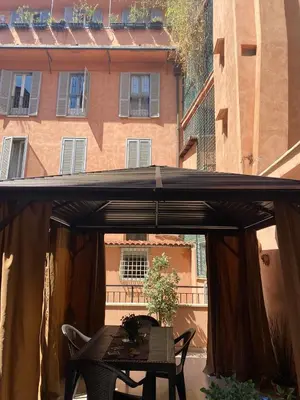 a metal door with a lock on it at Condotti Apartment in Rome
