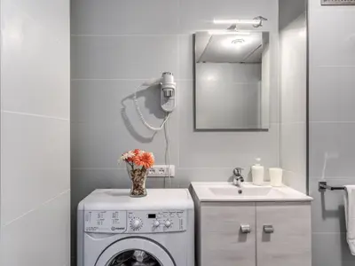 a bathroom with a washing machine and a sink at Apartment Wohnung mit Wi-Fi by Interhome in Rome