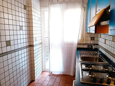 a small kitchen with a sink and a window at Apartment Rom-Ferienwohnungen - Case Vacanze Roma by Interhome in Rome