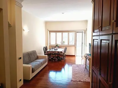 a living room with a couch and a table at Apartment Rom-Ferienwohnungen - Case Vacanze Roma by Interhome in Rome