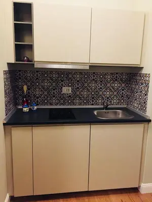 a kitchen with a sink and a counter top at FAIROME Apartment Cassia in Rome