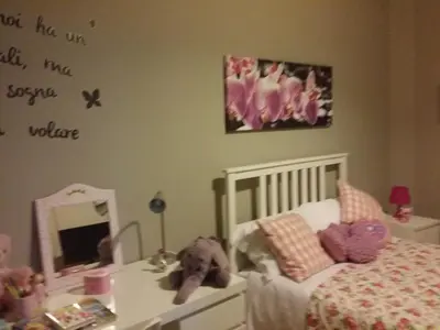 a childs bedroom with a bed and a mirror at Alexia Home in Rome