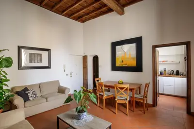 a living room with a couch and a table at The Right Place 4U Quercia Apartment in Rome