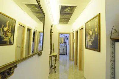 a hallway with paintings on the ceilings in a building at Casavamica in Rome