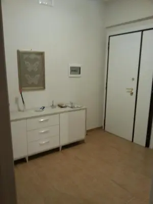 an empty room with a dresser and a door at Home Sweet Home in Rome