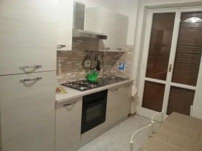 a kitchen with a sink and a stove top oven at Home Sweet Home in Rome