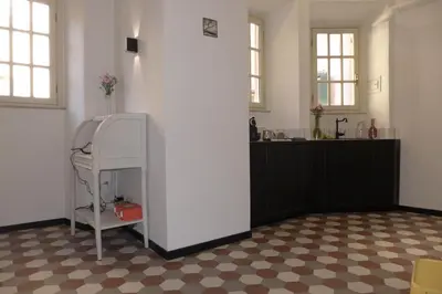 a room with a white wall and a counter at Guest House Interno4 in Rome