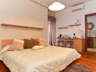 a bedroom with a large bed with pillows on it at B&B La Terrazza in Rome