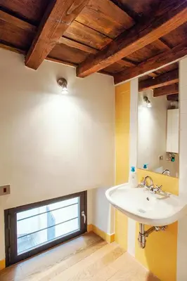 a bathroom with a sink and a window at Portico in Rome
