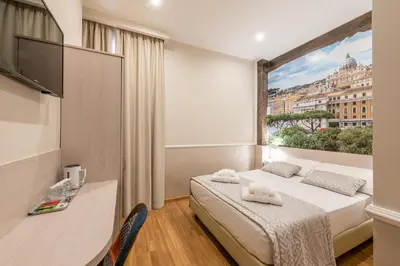 a bedroom with a bed and a large window at Top Floor Colosseo Guesthouse in Rome