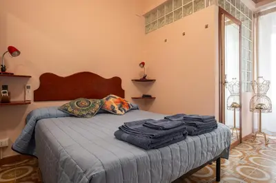 a bedroom with a bed with towels on it at Il Leoncino in Rome