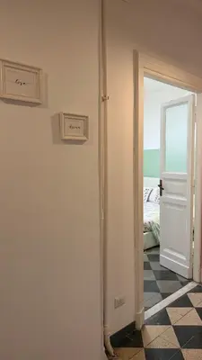 a room with a door and a room with a bedroom at St. John Apartment in Rome