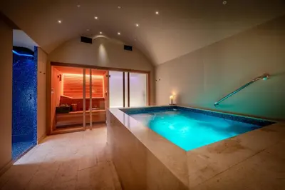 a large swimming pool in a room with a bathroom at Palazzo Dama - Hotel & SPA - Preferred Hotels & Resorts in Rome